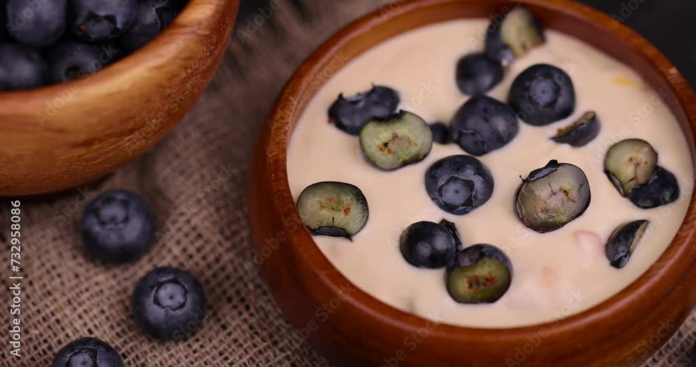 sliced blueberries for berry-flavored yogurt, ripe blueberries and fresh creamy yogurt sliced blueberries for berry-flavored yogurt, ripe blueberries and fresh creamy yogurt