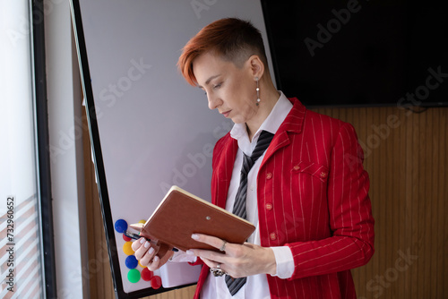 Businesswoman with diary in a bright office concept freelance work at home. 