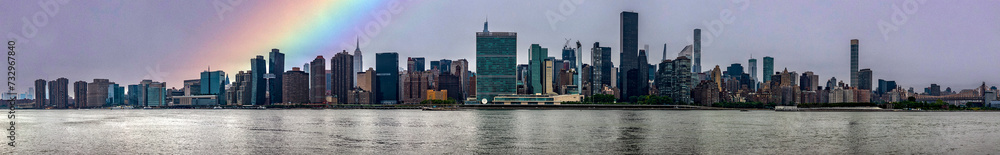 Great panoramic view of the Big Apple skyline with a rainbow from Long Island which is an island that extends across New York (USA) and one of the best viewpoints in Manhattan.