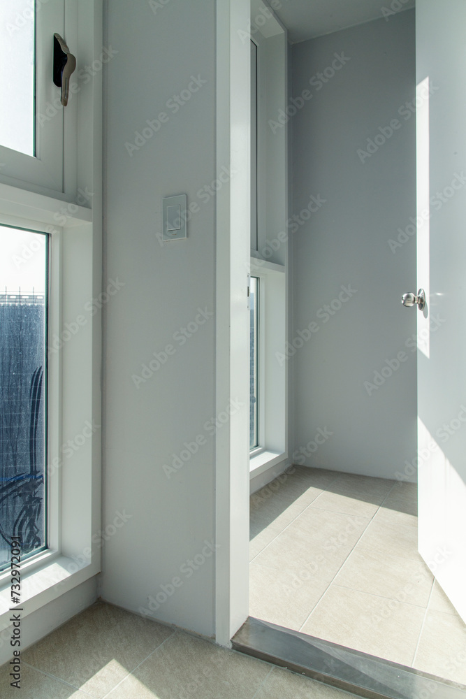 View of the windows on the balcony of a renovated apartment View of the windows on the balcony of a renovated apartment