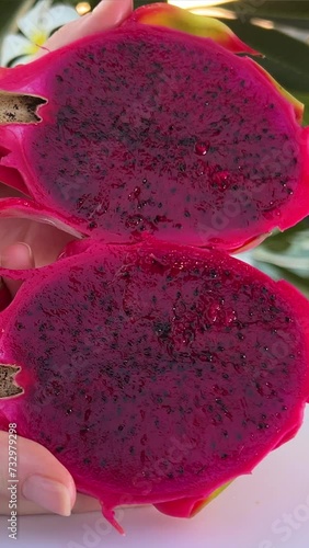 Woman Cutting Dragon Fruit, Pitaya In Half For Dessert. close up