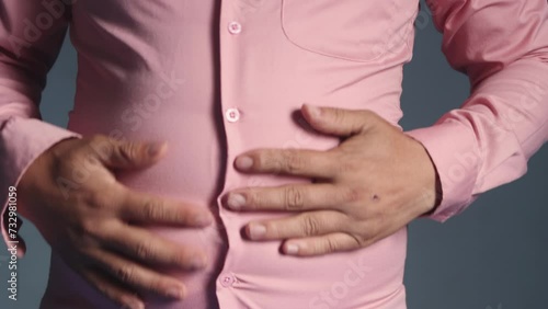 Front footage of over weight man touching and rub up-down tummy , over size and fat body wearing clothes concept, 4K 25fps hight resolution video