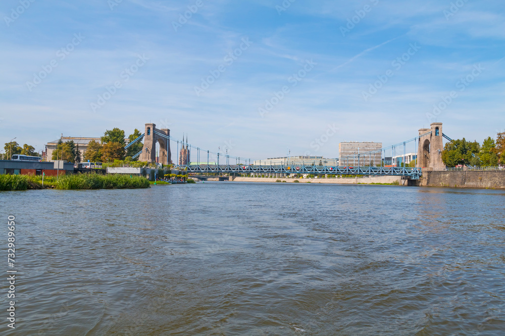 Naklejka premium A view from a boat sailing on the Odra River. The view to the Peace Bridge. Peace Bridge is located in Wrocław, Poland and was built from 1954 to 1959
