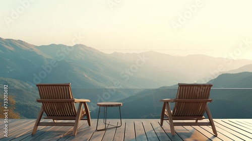 A serene morning landscape with chairs arranged to face majestic mountains.