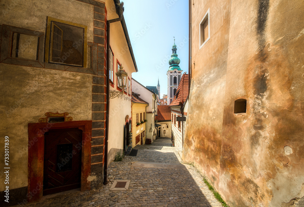 Alley in Beautiful Cesky Krumlov in the Czech Republic, with the Tower of St Jost Church