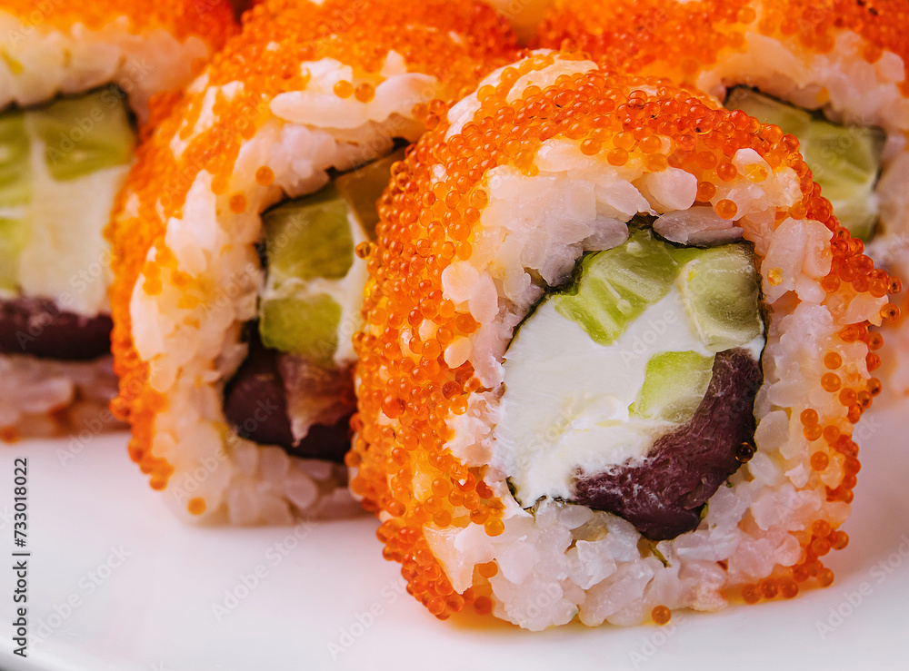 Macro shot of california maki sushi rolls with rice Macro shot of california maki sushi rolls with rice