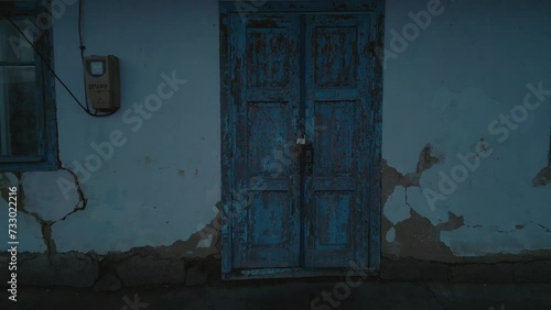a old blue door with lock pad