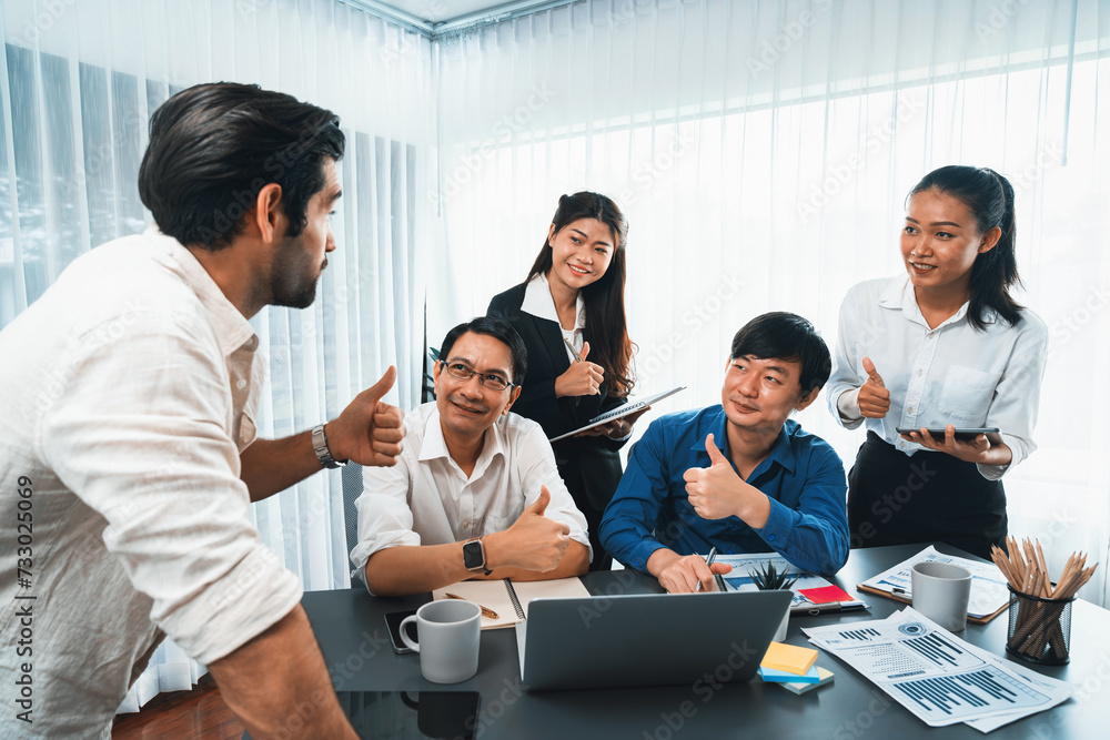 Excited and happy office worker employee celebrate after make successful strategic business marketing planning. Teamwork and positive attitude create productive and supportive workplace. Prudent