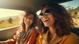A fun summer Trip of two Girlfriends in a car at sunset.
