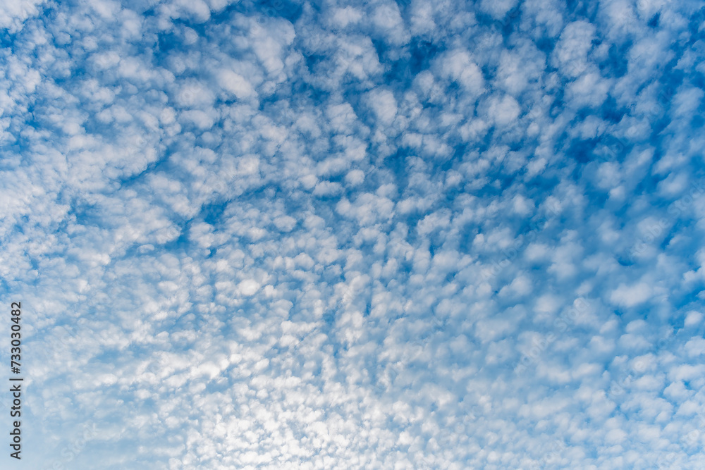 cloudy sky background for wallpaper and design, day skyscape with white beautiful clouds and blue sky