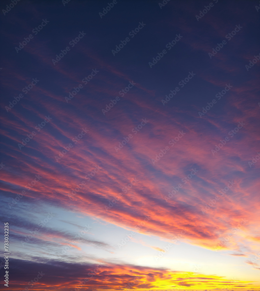 A real, amazing gradient sunset. Sky with delicate colorful clouds.