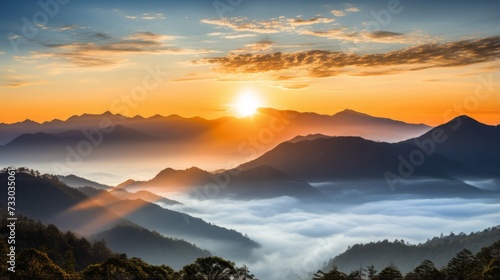 Peaceful sunrise over a misty mountain range