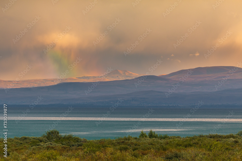 Sunset over Lake Sevan, mountain in the background. Armenia.
