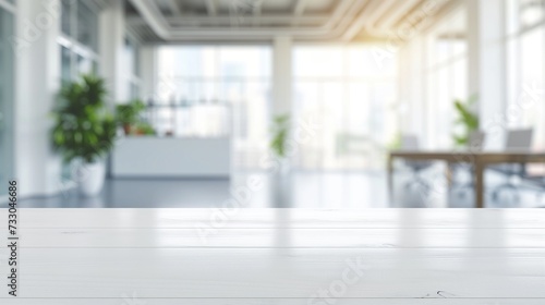 Empty White Table with Blurry Office Space Background © Sintrax