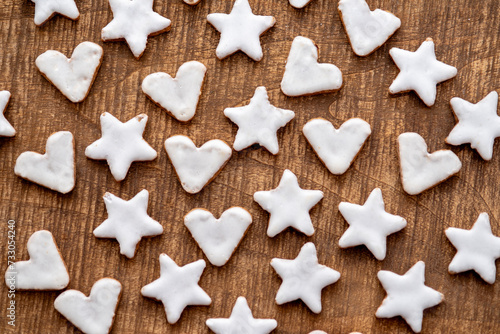 Cinnamon cookies for Christmas, in the shape of hearts and stars