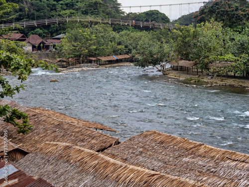 Suspension bridge over Lau Bohorok river, Bukit Lawang Sumatra, Indonesia photo
