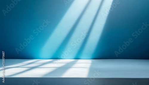abstract blue studio background for product presentation empty room with shadows of window display product with blurred backdrop
