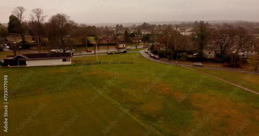 Aerial of Southborough common park with autumn trees and cars on the streets on a foggy day Aerial of Southborough common park with autumn trees and cars on the streets on a foggy day
