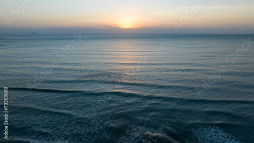 Aerial view of beautiful sea wave and sunrise sky