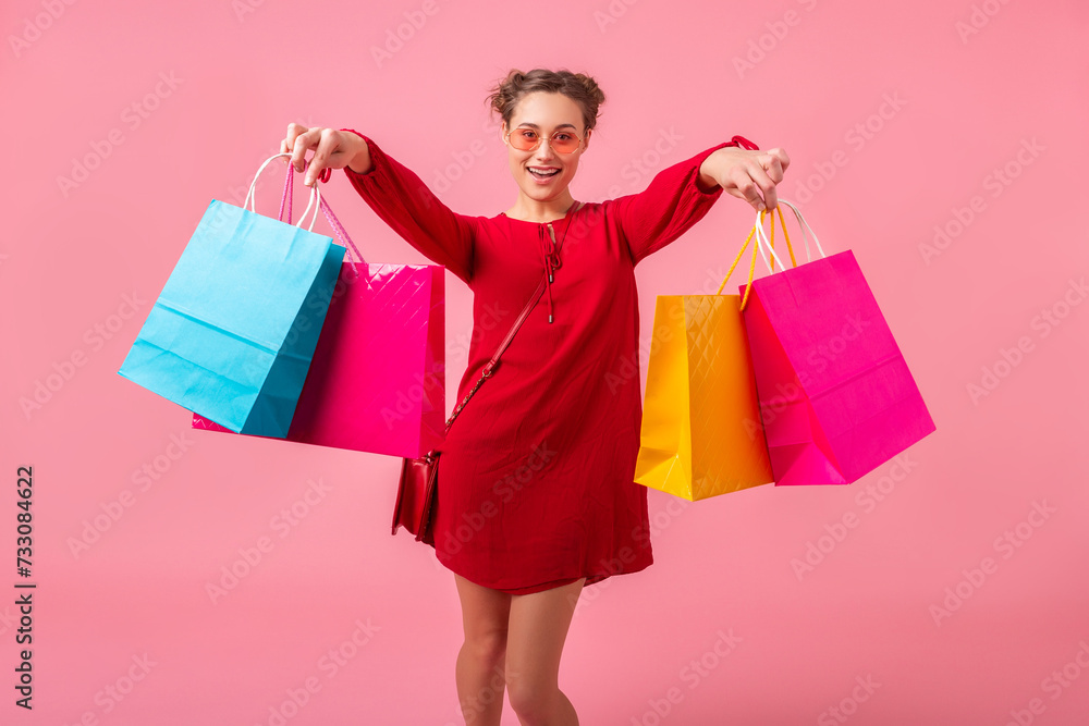 attractive happy smiling stylish woman holding shopping bags