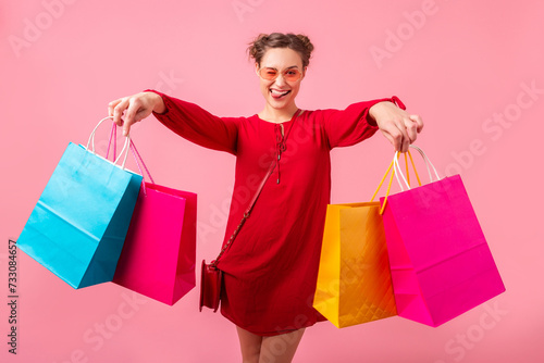 attractive happy smiling stylish woman holding shopping bags