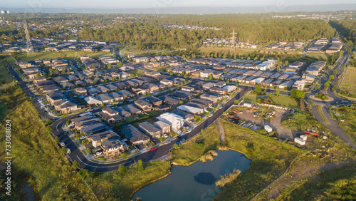 Aerial drone view of Jordan Springs East, known as the sinking suburb, in western Sydney, NSW Australia on a sunny morning in February 2024 photo