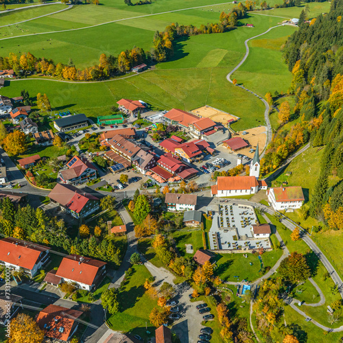Die idyllisch gelegene Gemeinde Unterjoch im Allgäu im Luftbild photo