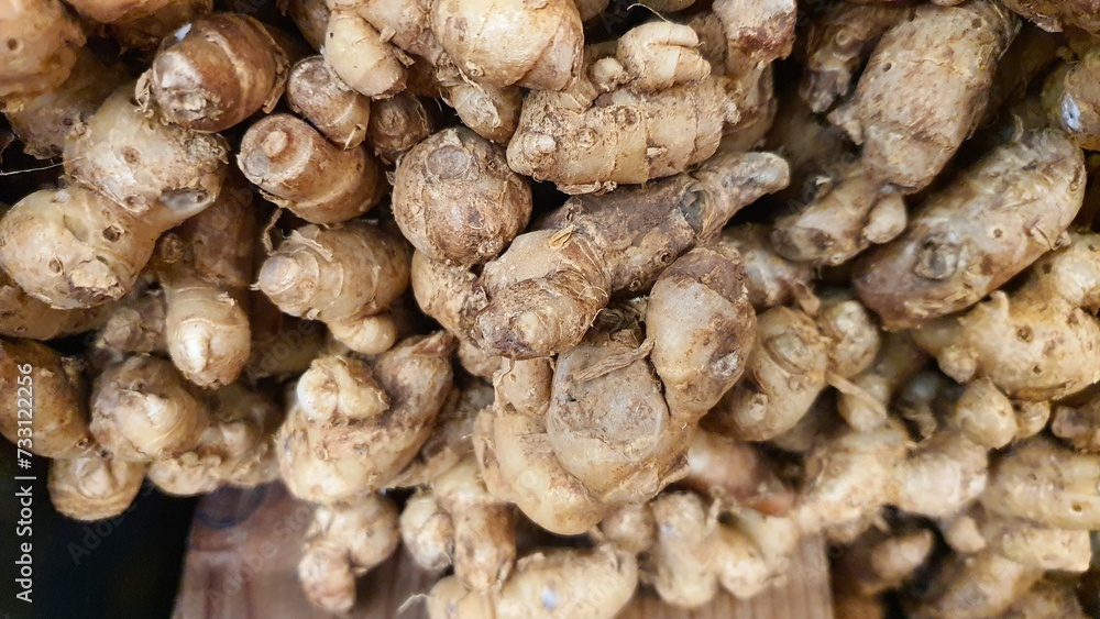 Close up pile of tasty fresh ginger sold at the market as a background. Close up pile of tasty fresh ginger sold at the market as a background.