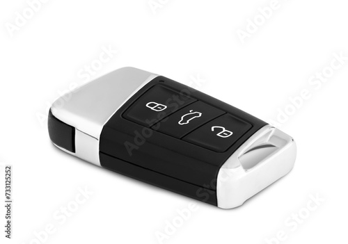Car ignition key close up isolated. The key is made of black plastic and a metal insert, with three buttons.