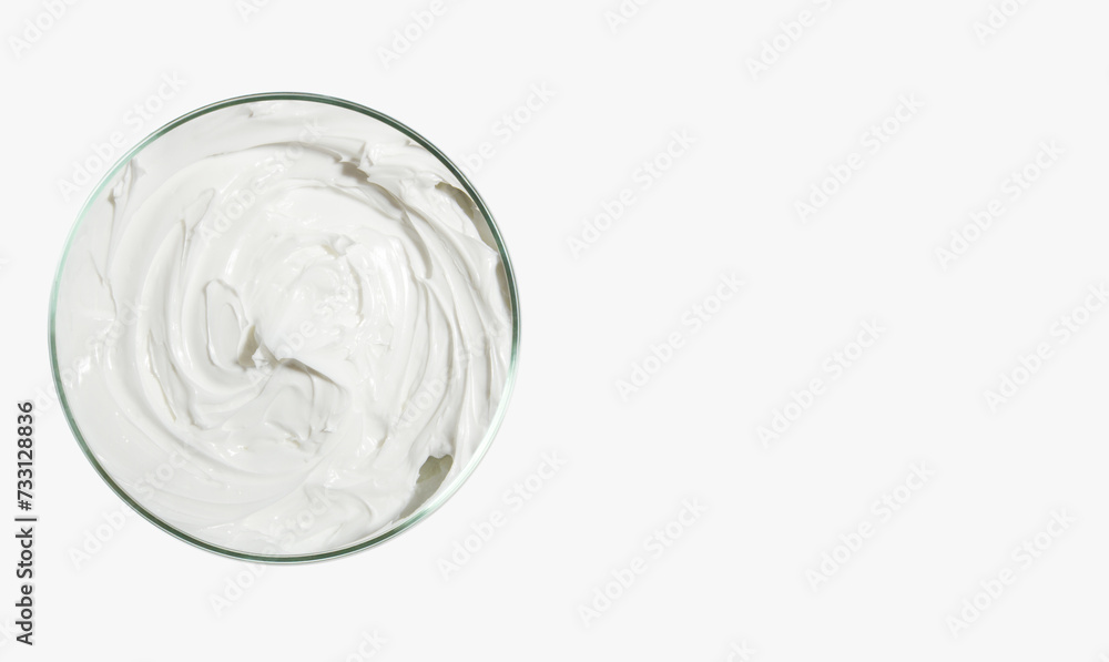 Face and body cream in a round jar or Petri dish. on a light background. View from above Face and body cream in a round jar or Petri dish. on a light background. View from above