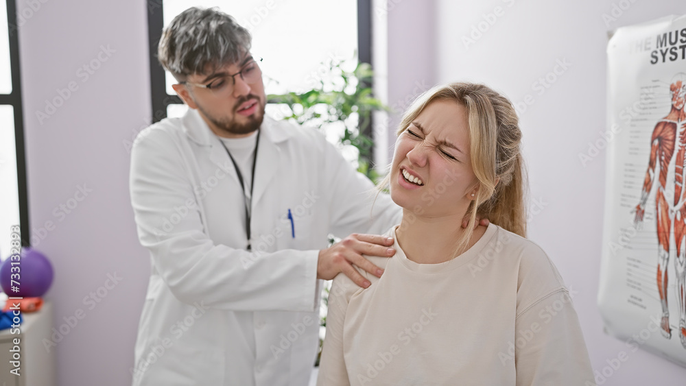 A male physiotherapist evaluates a woman's neck pain in a bright rehabilitation clinic. A male physiotherapist evaluates a woman's neck pain in a bright rehabilitation clinic.