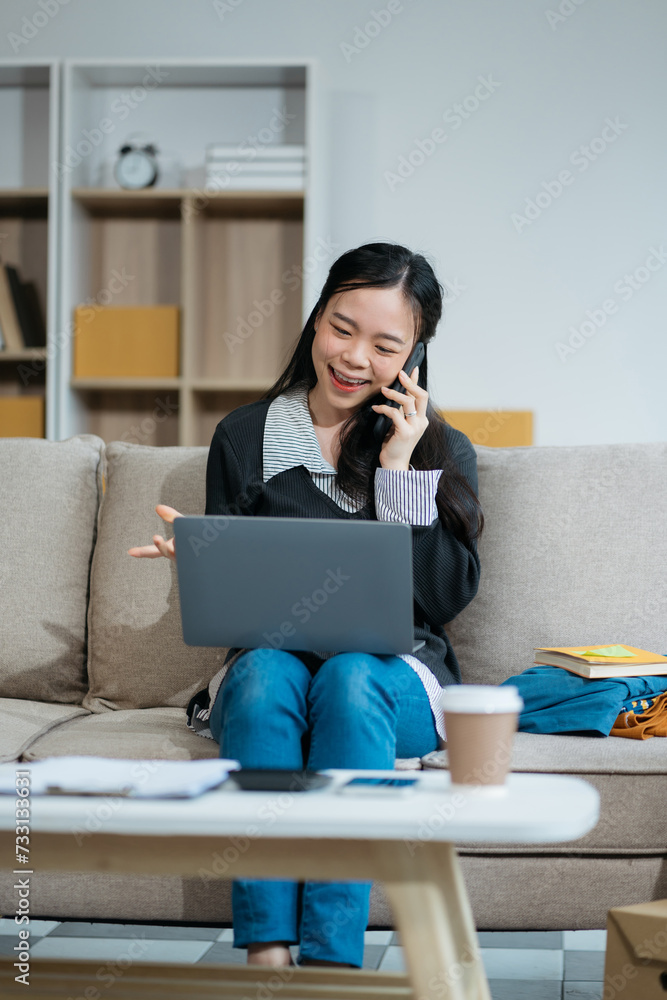 young asian women using smartphone contacted a customer asking for a shipping address young asian women using smartphone contacted a customer asking for a shipping address