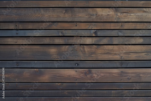 Wallpaper Mural A wall of wooden slats in the color of dark wood with a pattern of wall panels in the texture background Torontodigital.ca