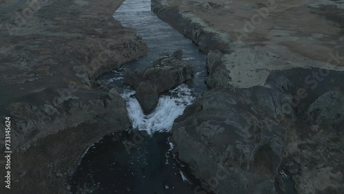 HJALPARFOSS Waterfall Iceland landscape . 4K DJI drone aerial footage photo