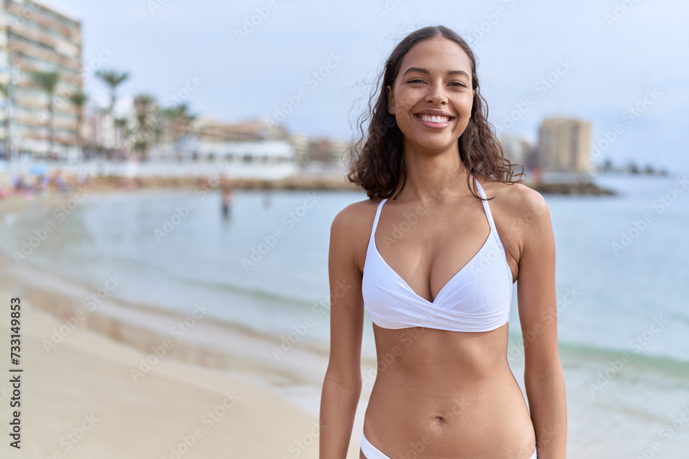 Young african american woman tourist smiling confident wearing bikini at beach Young african american woman tourist smiling confident wearing bikini at beach