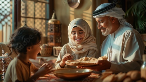 Happy Middle Eastern family shares food at dining table on Ramadan