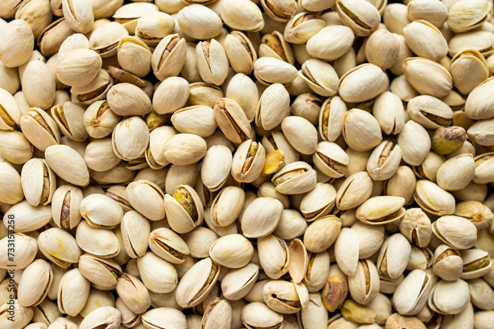 Texture and background of pistachios. Delicious pistachios as a background, like the texture of pistachios. flat layю