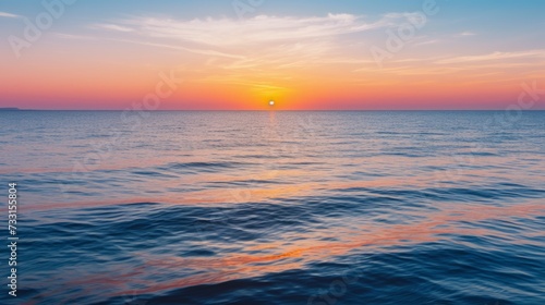 Tranquil ocean sunset with the last light of day reflecting on the water