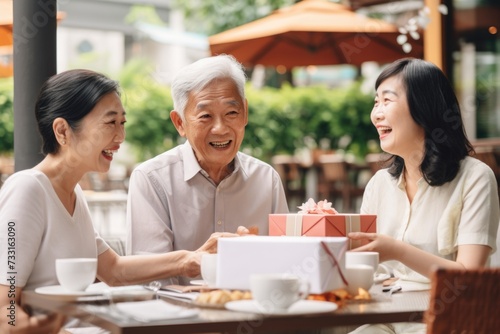 Surprising Asian couple celebrates fathers day with elderly father.