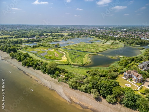 The drone aerial view of WWT London Wetland Centre. WWT London Wetland Centre is a wetland reserve in the Barnes area of the London Borough of Richmond upon Thames. © yujie