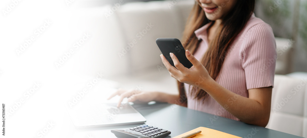 Confident businesswoman working on laptop,tablet and smartphone at her workplace at office... Confident businesswoman working on laptop,tablet and smartphone at her workplace at office...