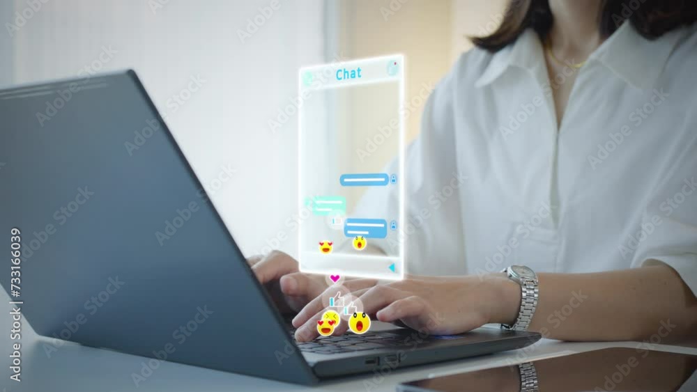 Woman using computer type text conversation chat online social media send feelings like love smile laugh heart emoji icons interactive.