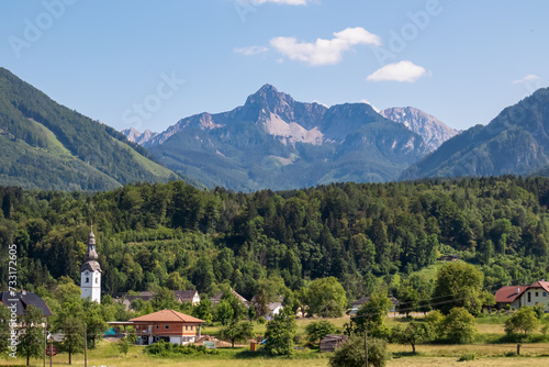 Remote village with scenic view of untamed mountain peaks of Karawanks seen from Feistritz im Rosental  Carinthia  Austria. Majestic Wertatscha and Kosiak summit in summer. Hiking in Austrian Alps