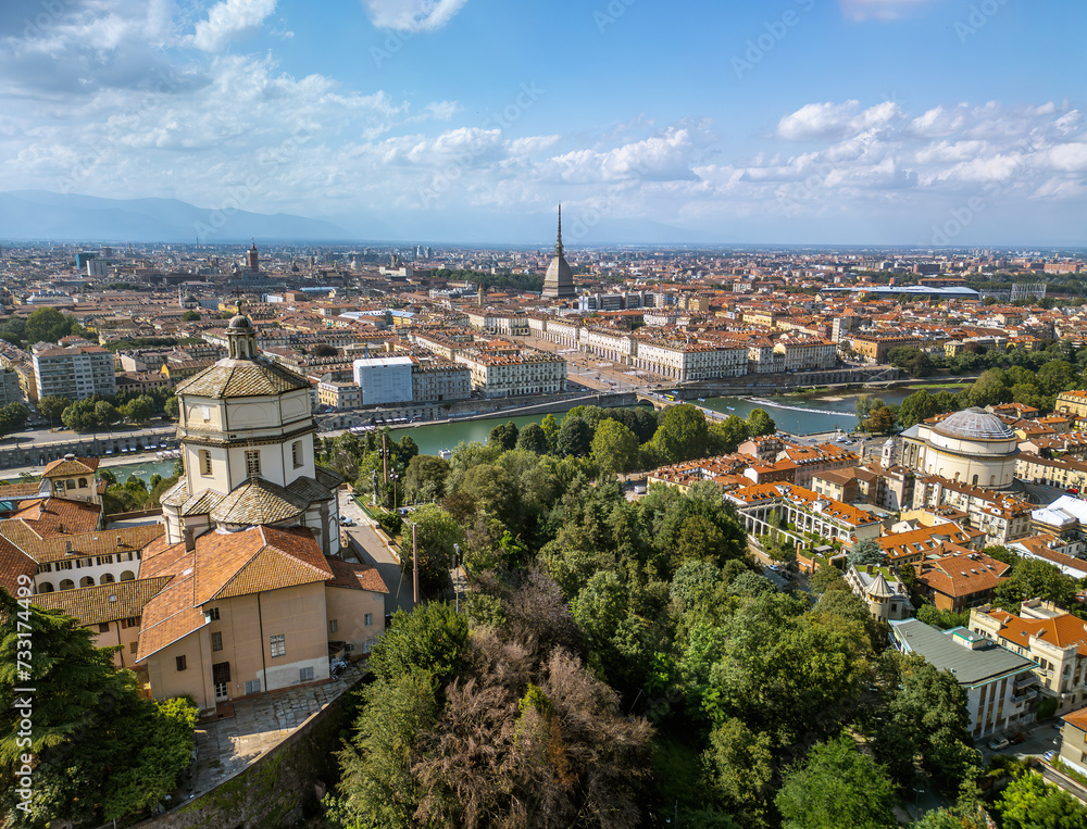 The drone aerial view of Church of Santa Maria al Monte dei Cappuccini and Turin city, Italy. 