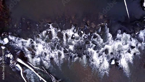 river in winter with rocks