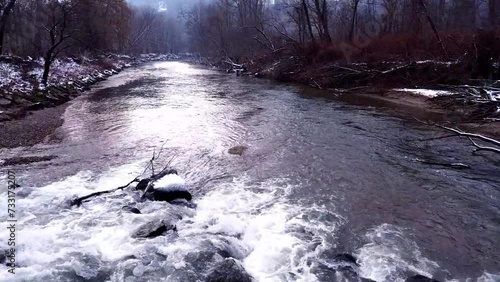 river in winter with rocks