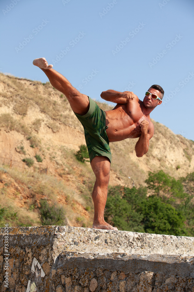 Sports guy on the beach in the summer season Sports guy on the beach in the summer season