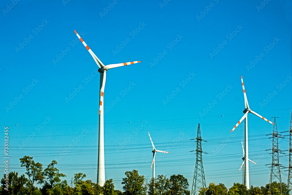 wind power station along the highway during the day. Saving electricity wind power station along the highway during the day. Saving electricity