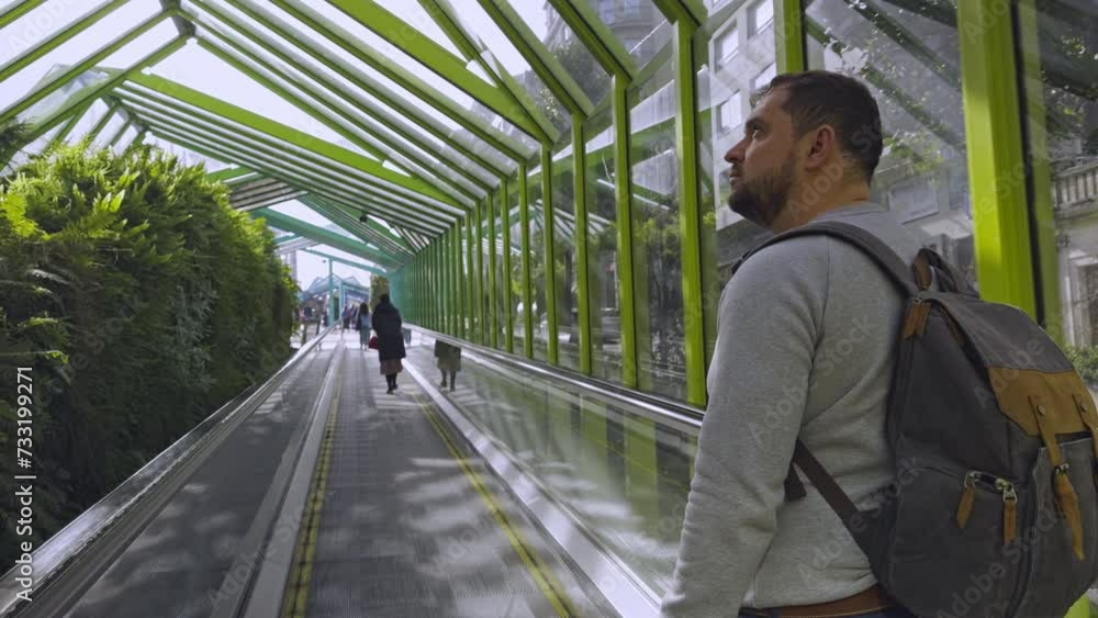 Urban Explorer: Man with Backpack on Escalator Journey Urban Explorer: Man with Backpack on Escalator Journey