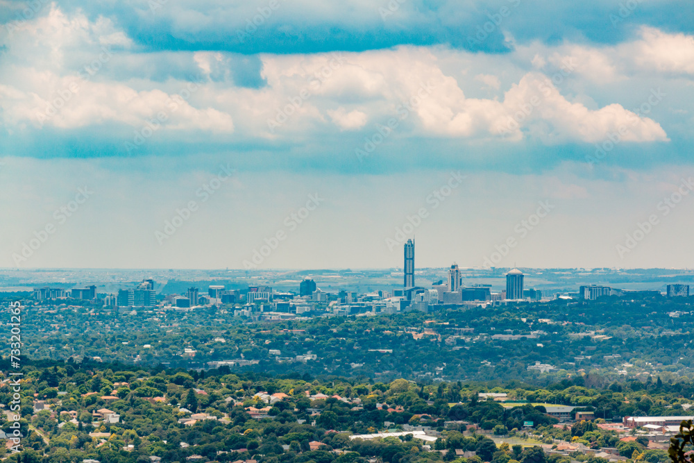 Fototapeta premium Skyline - view of Sandton - Johannesburg - Gauteng - South Africa - Big business - Corporate - Big sky above with clouds